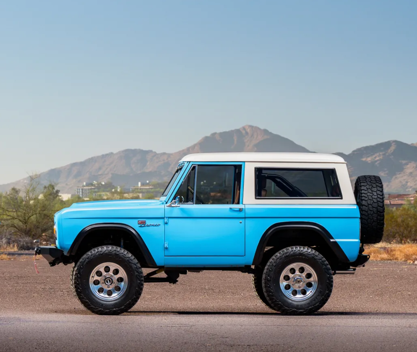 A fully restored classic Bronco at Sexton Offroad Park City, featuring a Coyote engine swap, custom paint, and interior, combining vintage style with modern performance and upgrades.