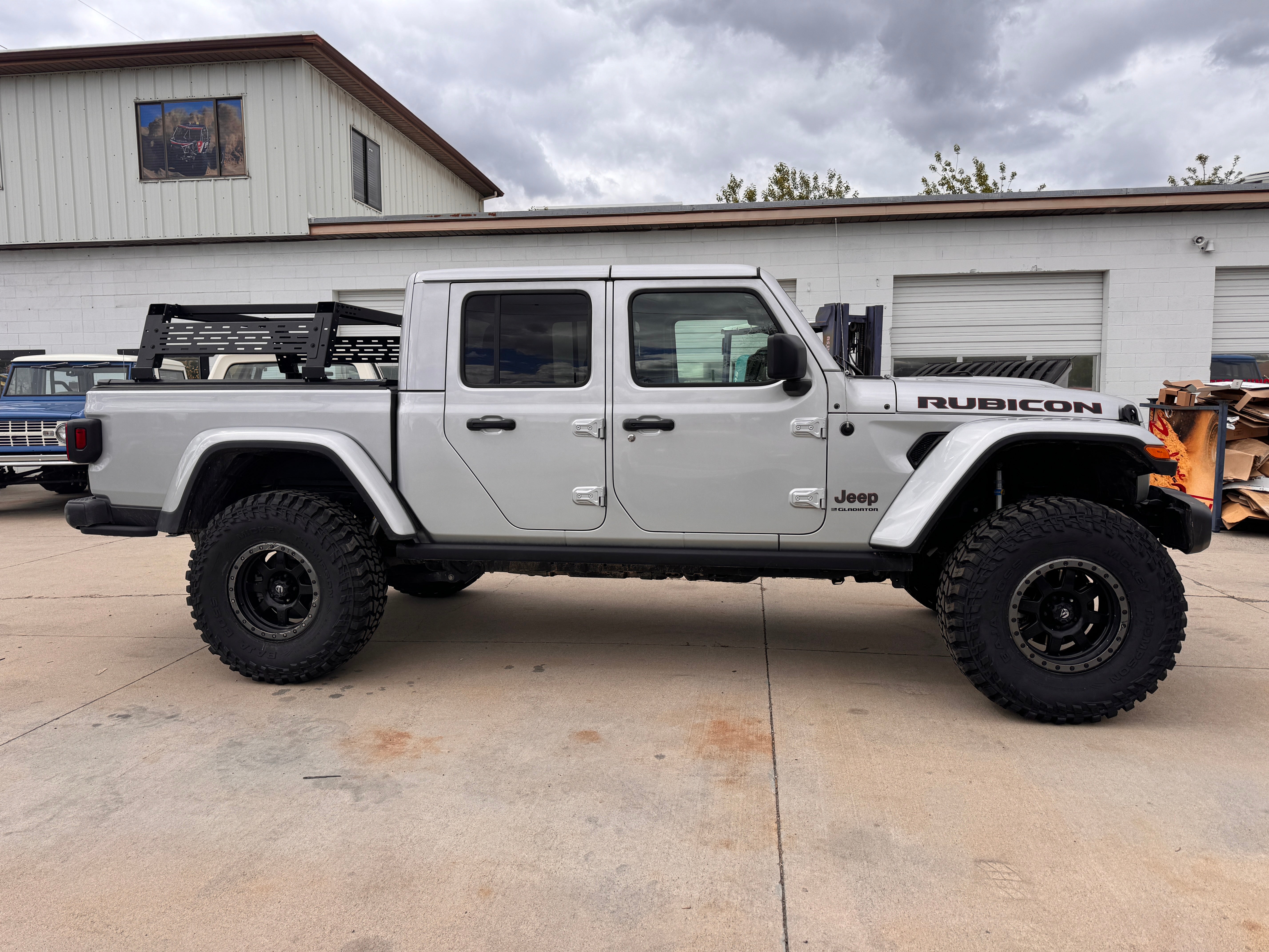 Lifted Jeep Gladiator with upgraded suspension at Sexton Offroad in Salt Lake City and Park City, UT, for enhanced off-road capability and rugged style.